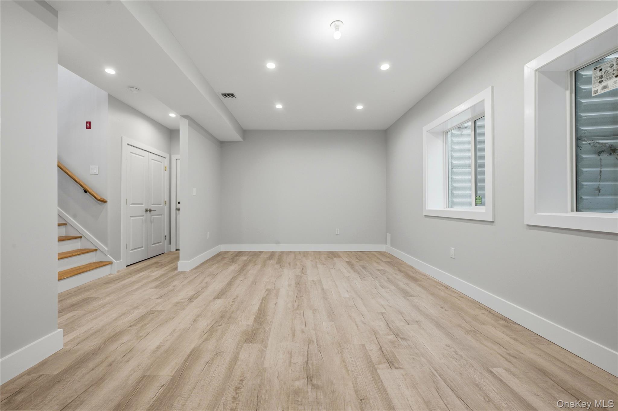 15 Manchester Road Rock Hill, NY 12775 - Photo 30 of 46 an empty room with wooden floor and windows
