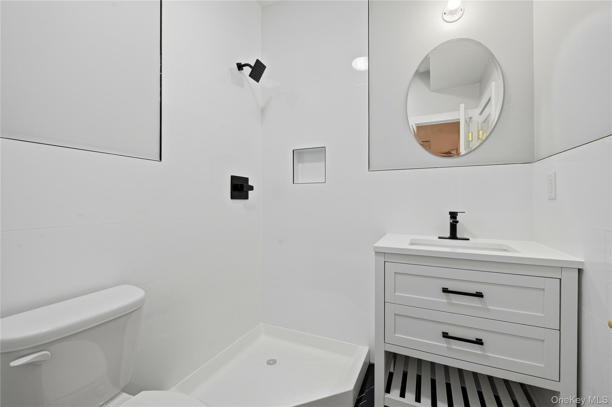 15 Manchester Road Rock Hill, NY 12775 - Photo 31 of 46 a bathroom with a sink a mirror and a bathtub