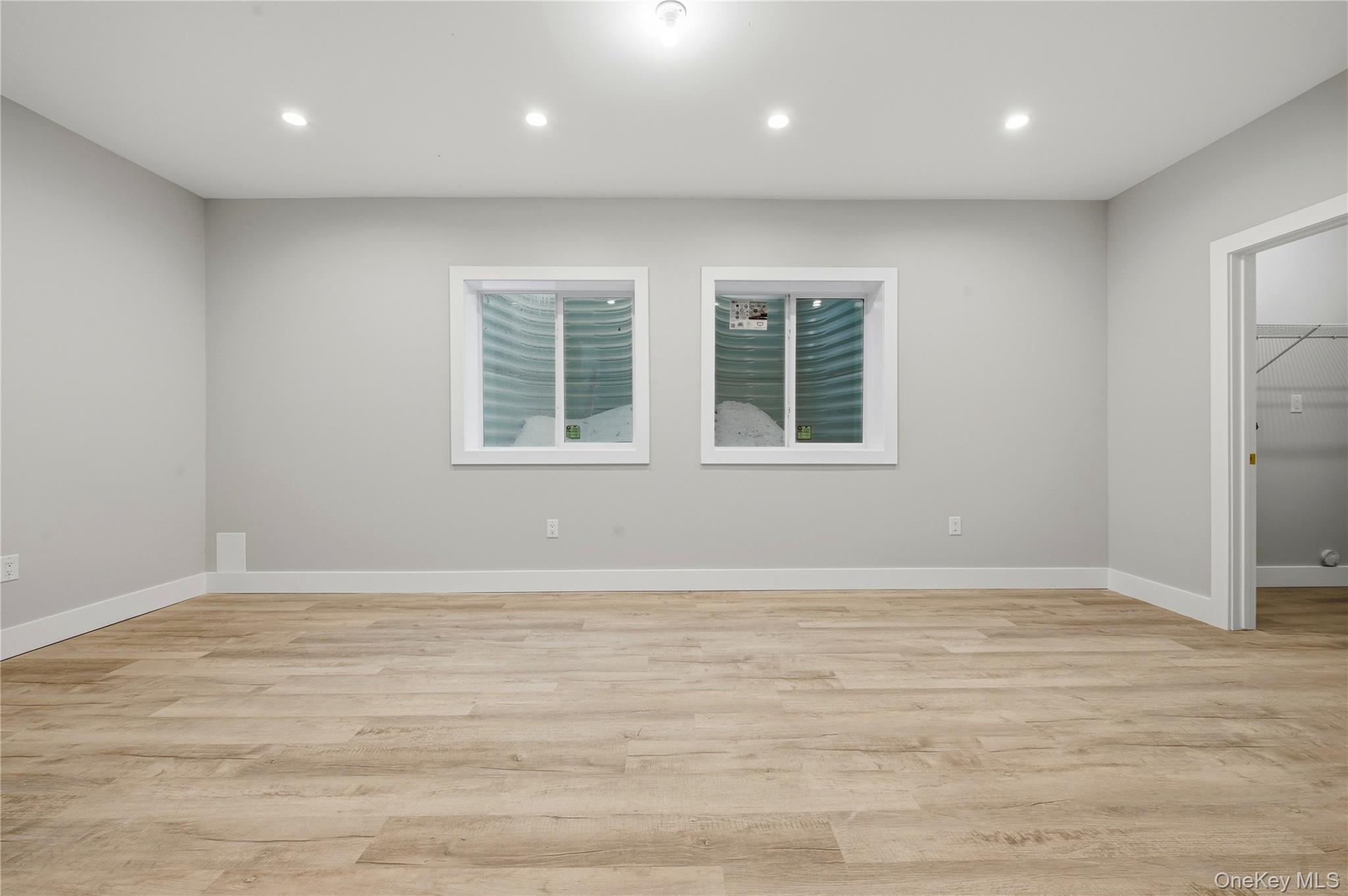 15 Manchester Road Rock Hill, NY 12775 - Photo 35 of 46 an empty room with wooden floor and windows