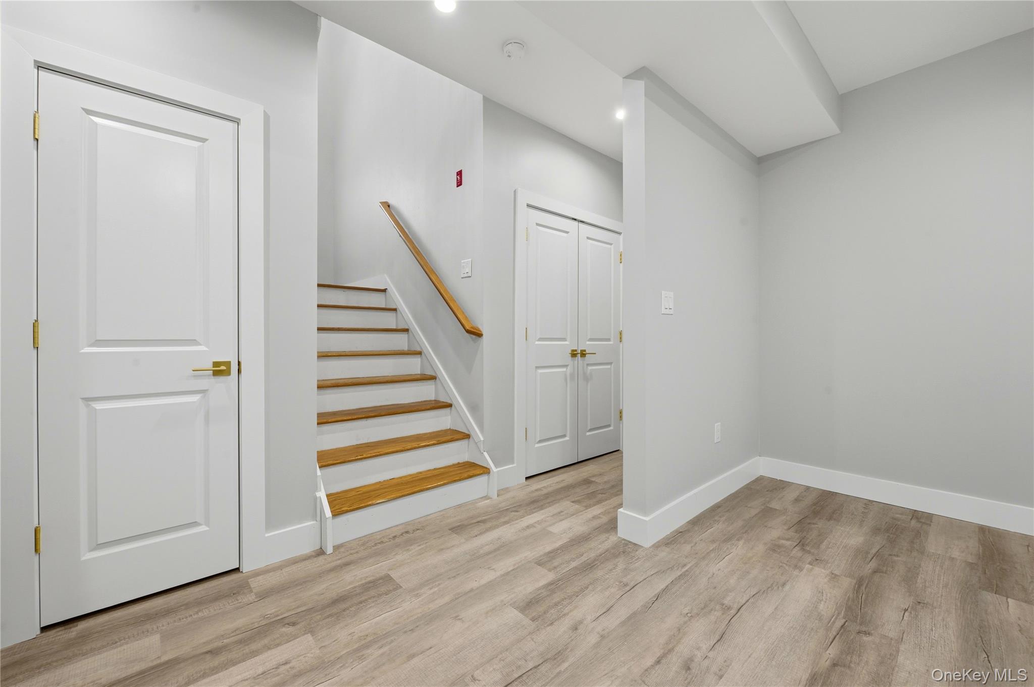 15 Manchester Road Rock Hill, NY 12775 - Photo 36 of 46 wooden floor in an empty room with a gallery