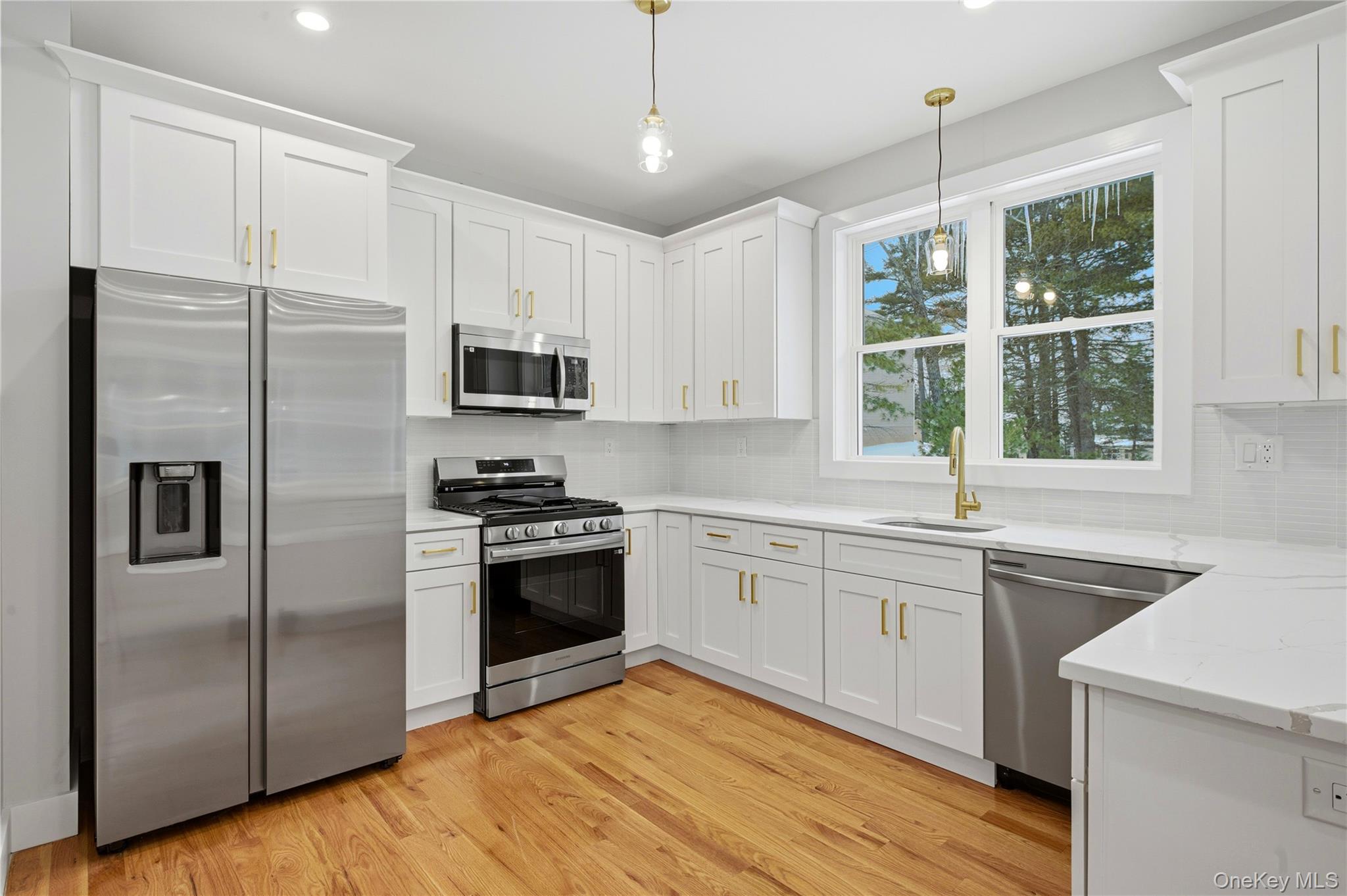 15 Manchester Road Rock Hill, NY 12775 - Photo 40 of 46 a kitchen with stainless steel appliances granite countertop a stove a sink and a refrigerator