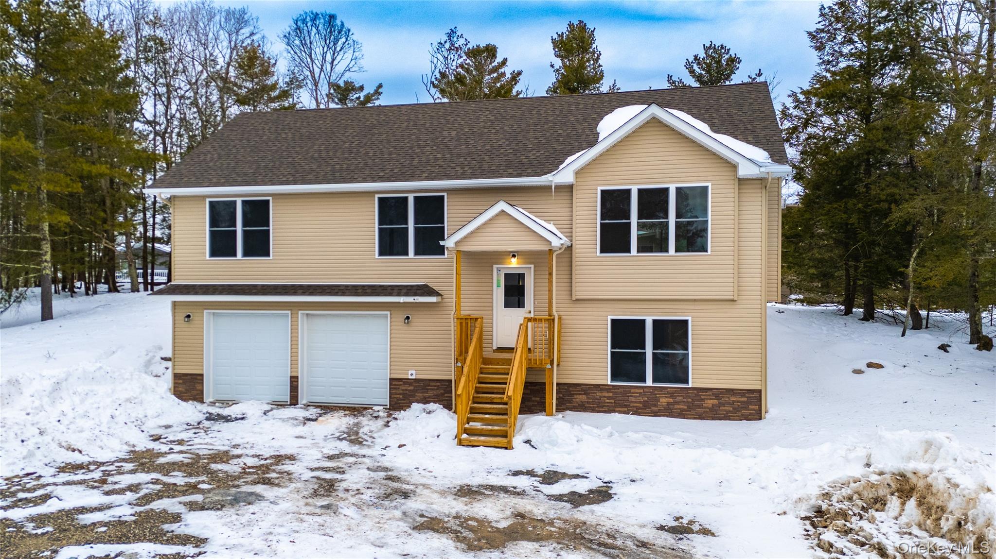 15 Manchester Road Rock Hill, NY 12775 - Photo 42 of 46 a front view of a house with a yard covered with snow in front of house