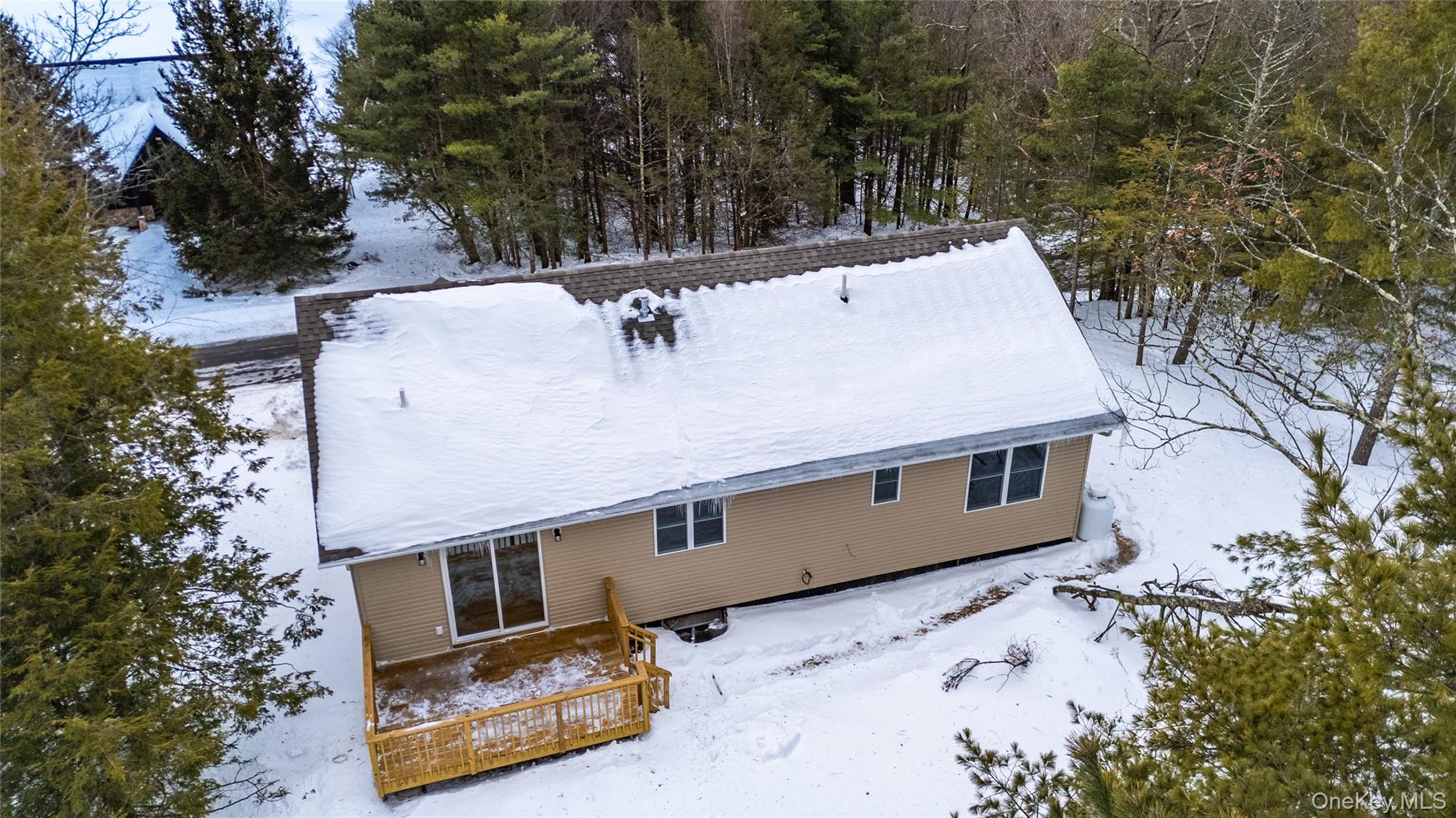 15 Manchester Road Rock Hill, NY 12775 - Photo 44 of 46 a view of a roof with wooden fence