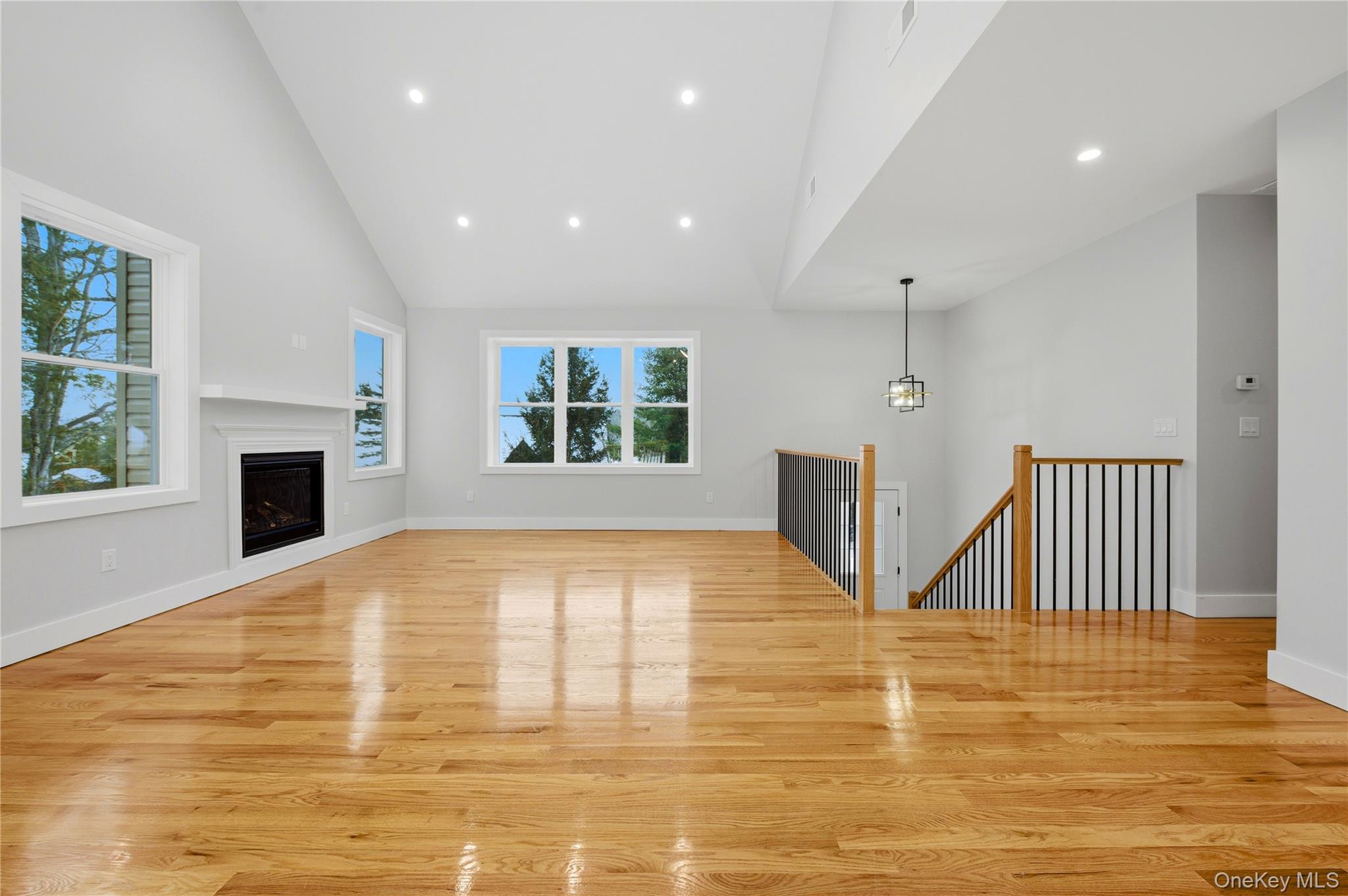 15 Manchester Road Rock Hill, NY 12775 - Photo 8 of 46 a view of an empty room with a fireplace and a window