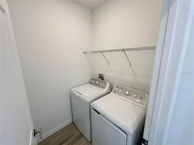 a utility room with dryer and washer