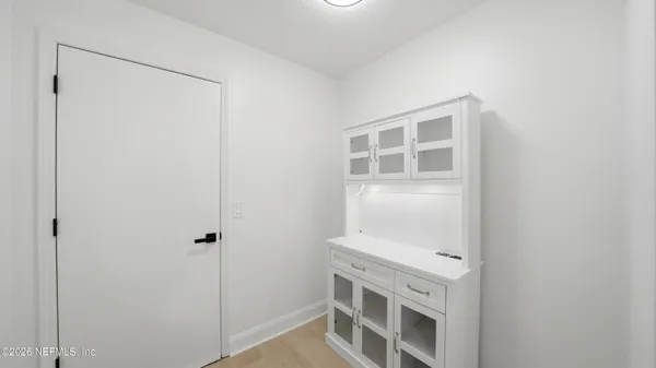 a view of an empty room with a window