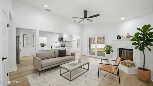 a living room with furniture and a large window