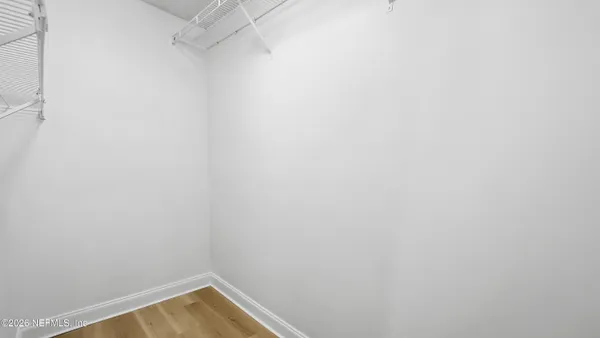 a view of a small space with racks on the wall