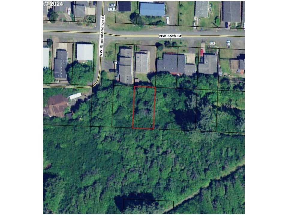 0 Northwest Rhododendron Street, Unit 9 10 11 Newport, OR 97365 - Photo 2 of 6 a view of a house with a backyard and porch