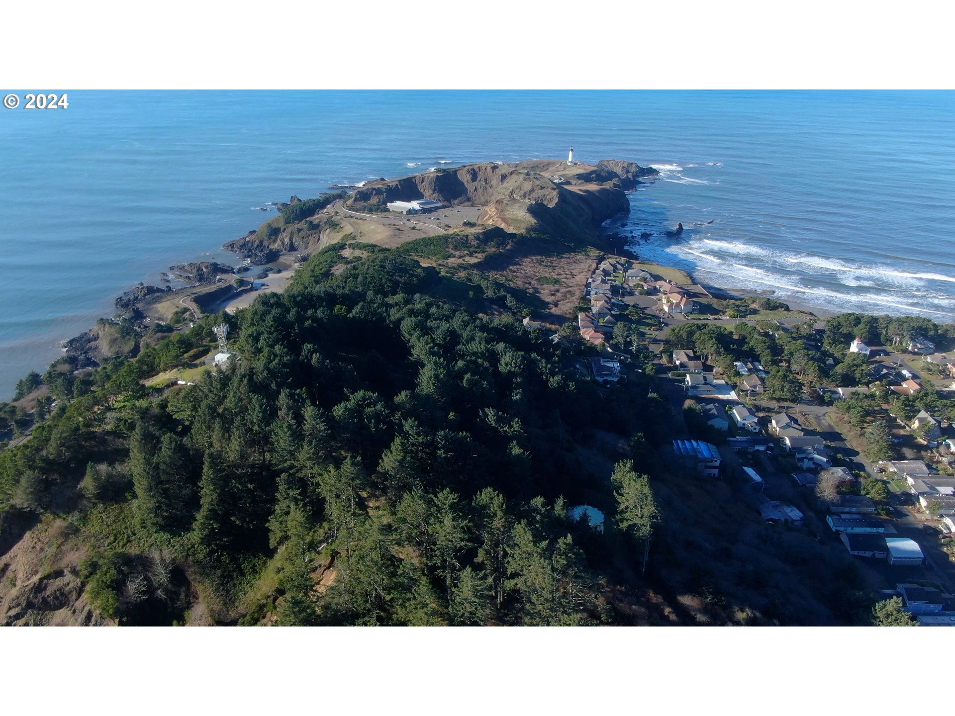 0 Northwest Rhododendron Street, Unit 9 10 11 Newport, OR 97365 - Photo 6 of 6 a black and white photo of a house