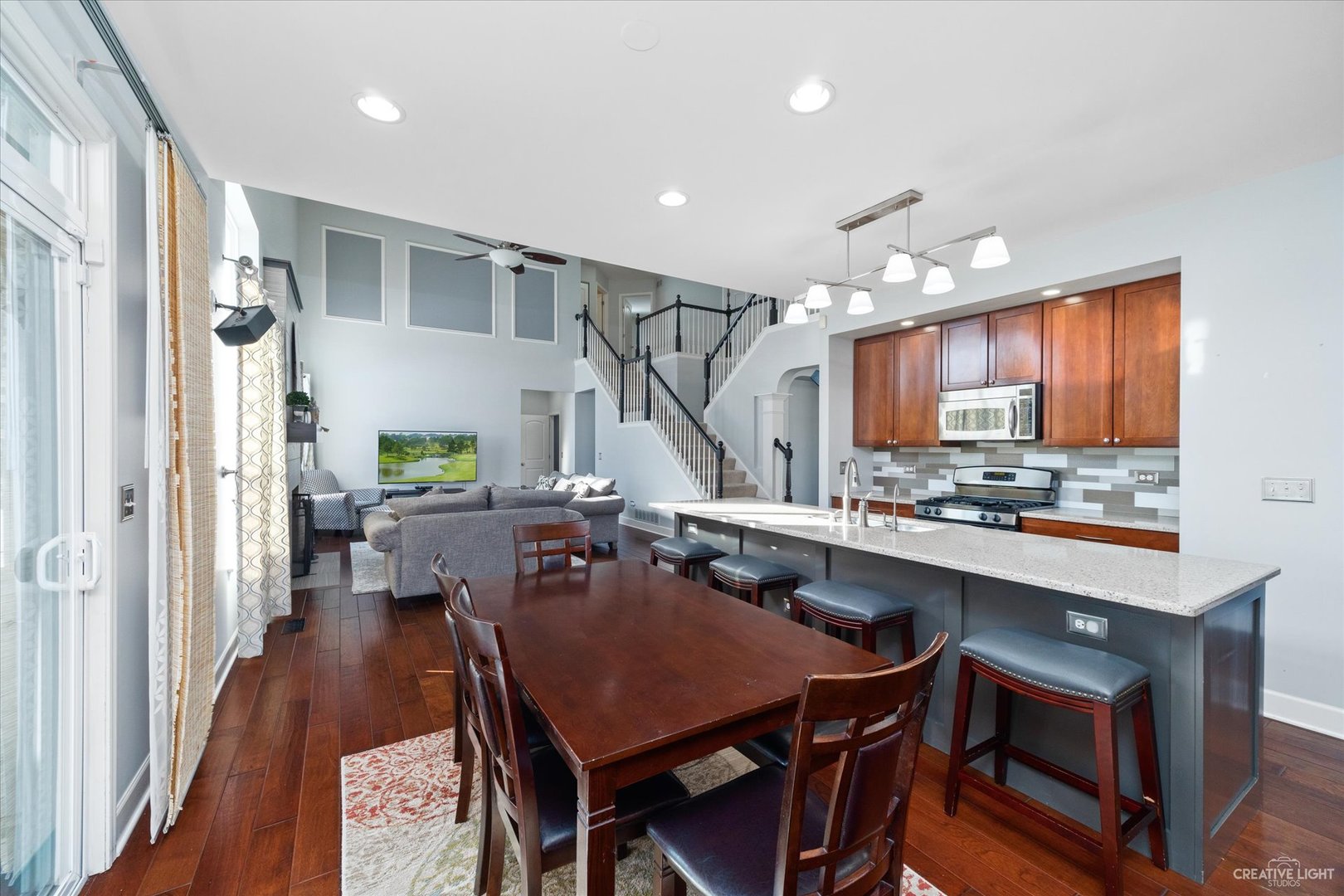 2933 Kelly Drive Elgin, IL 60124 - Photo 16 of 52 a kitchen with a table chairs refrigerator and wooden cabinets