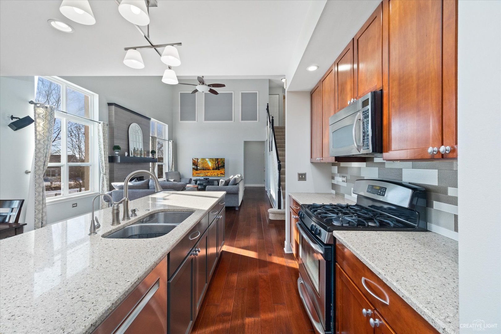 2933 Kelly Drive Elgin, IL 60124 - Photo 17 of 52 a kitchen with granite countertop a sink a counter top space cabinets and stainless steel appliances