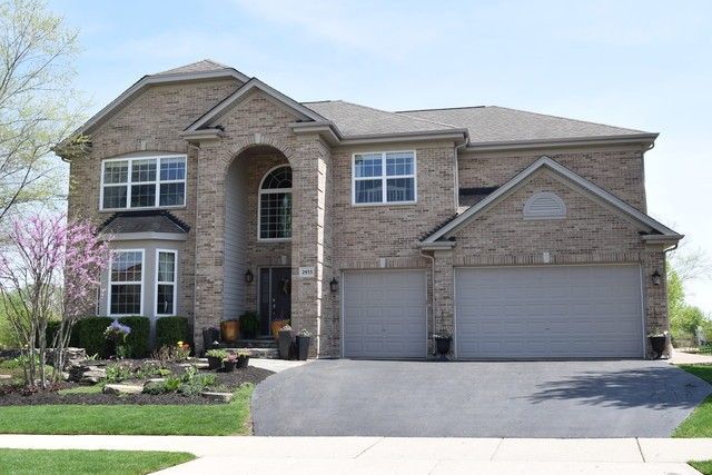 2933 Kelly Drive Elgin, IL 60124 - Photo 2 of 52 a front view of a house with yard and seating space