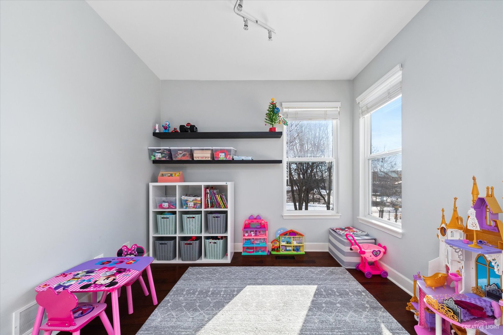 2933 Kelly Drive Elgin, IL 60124 - Photo 21 of 52 a living room with baby toys and a book shelf