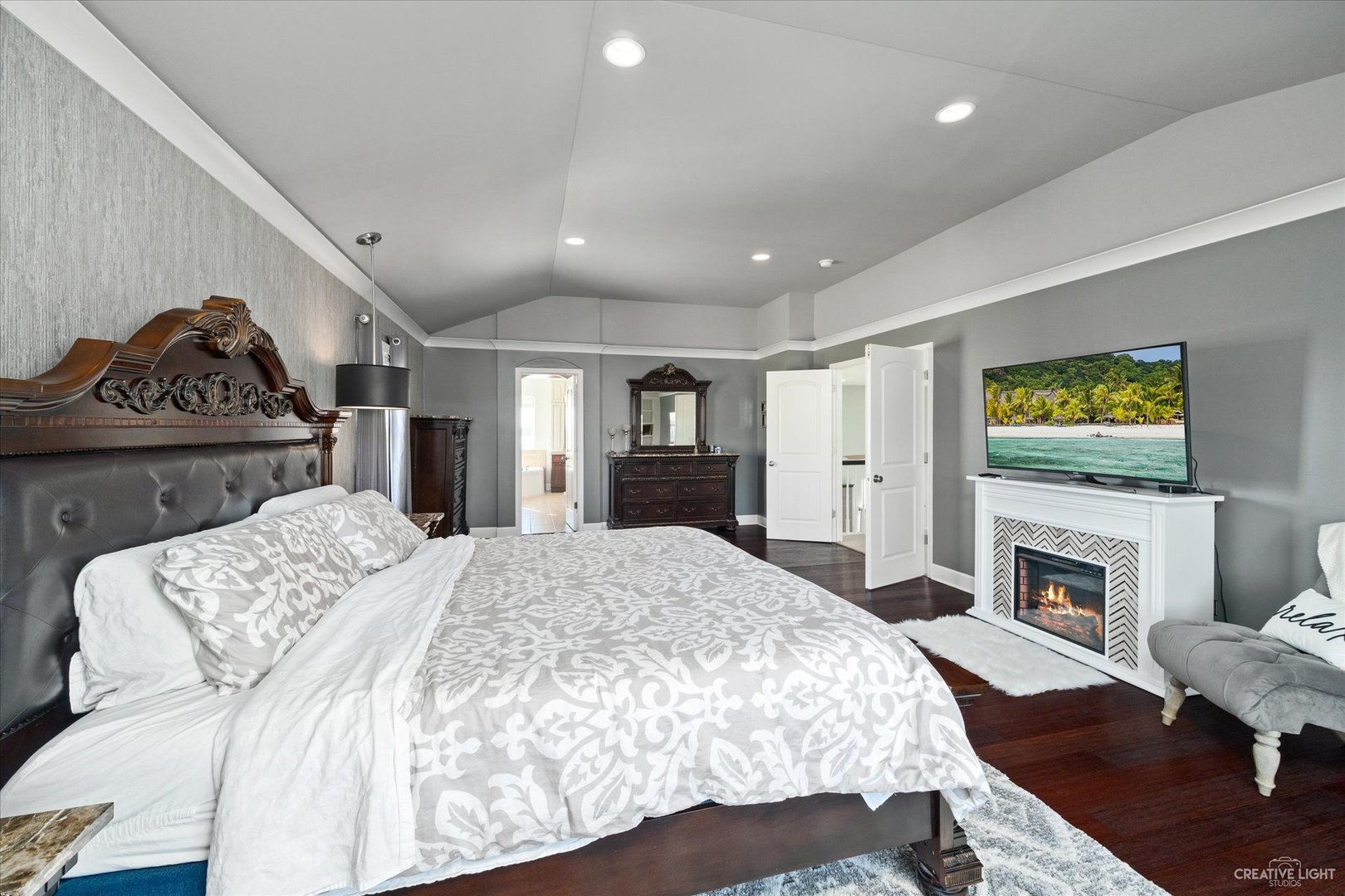 2933 Kelly Drive Elgin, IL 60124 - Photo 27 of 52 a spacious bedroom with a bed and a fireplace