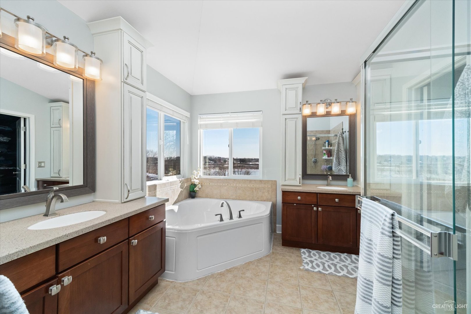 2933 Kelly Drive Elgin, IL 60124 - Photo 28 of 52 a spacious bathroom with a tub sink shower and mirror