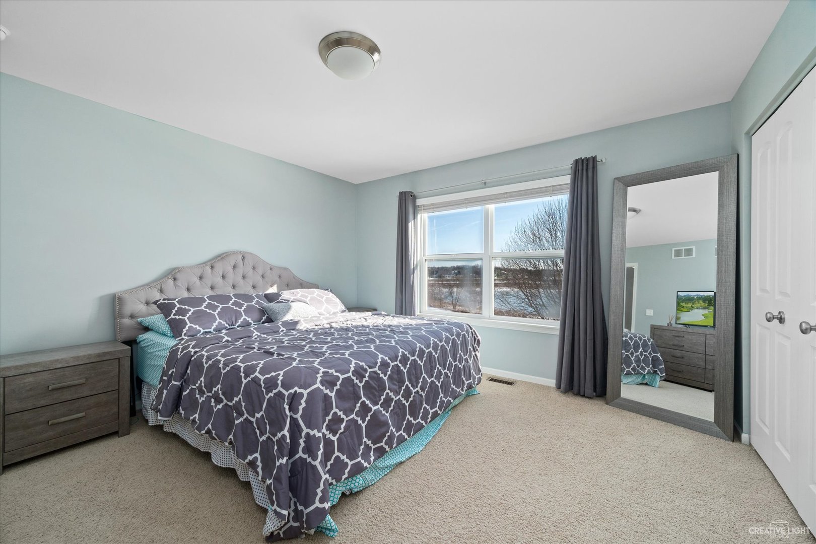 2933 Kelly Drive Elgin, IL 60124 - Photo 30 of 52 a bed sitting in a room next to a window