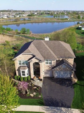 2933 Kelly Drive Elgin, IL 60124 - Photo 3 of 52 an aerial view of a house with a lake view