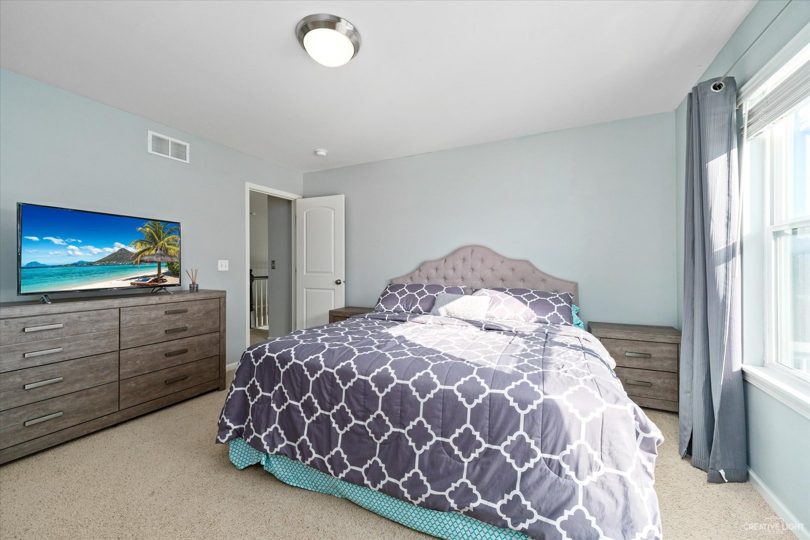 2933 Kelly Drive Elgin, IL 60124 - Photo 31 of 52 a bedroom with a bed and a flat screen tv