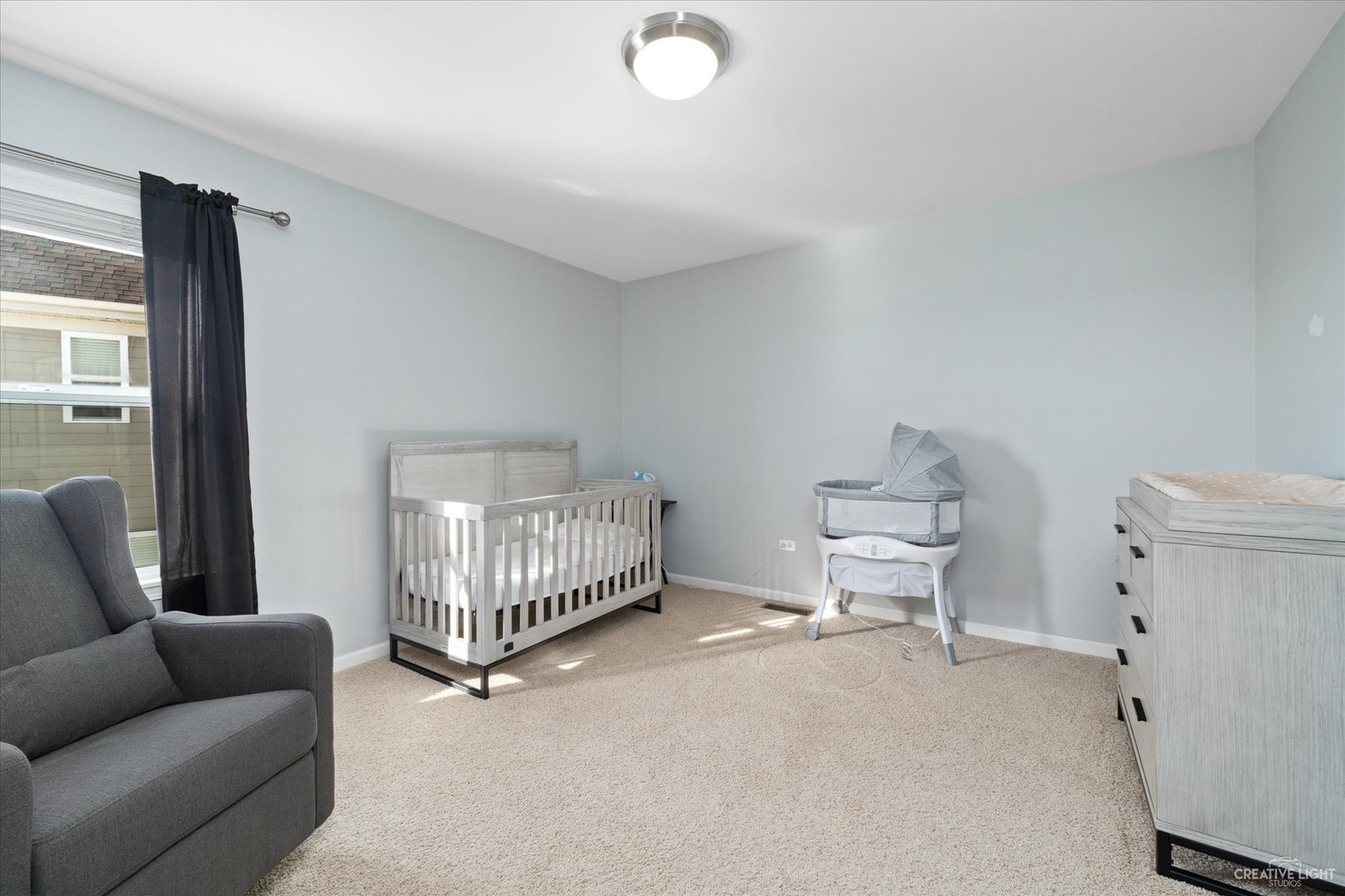 2933 Kelly Drive Elgin, IL 60124 - Photo 33 of 52 a living room with furniture and a baby crib