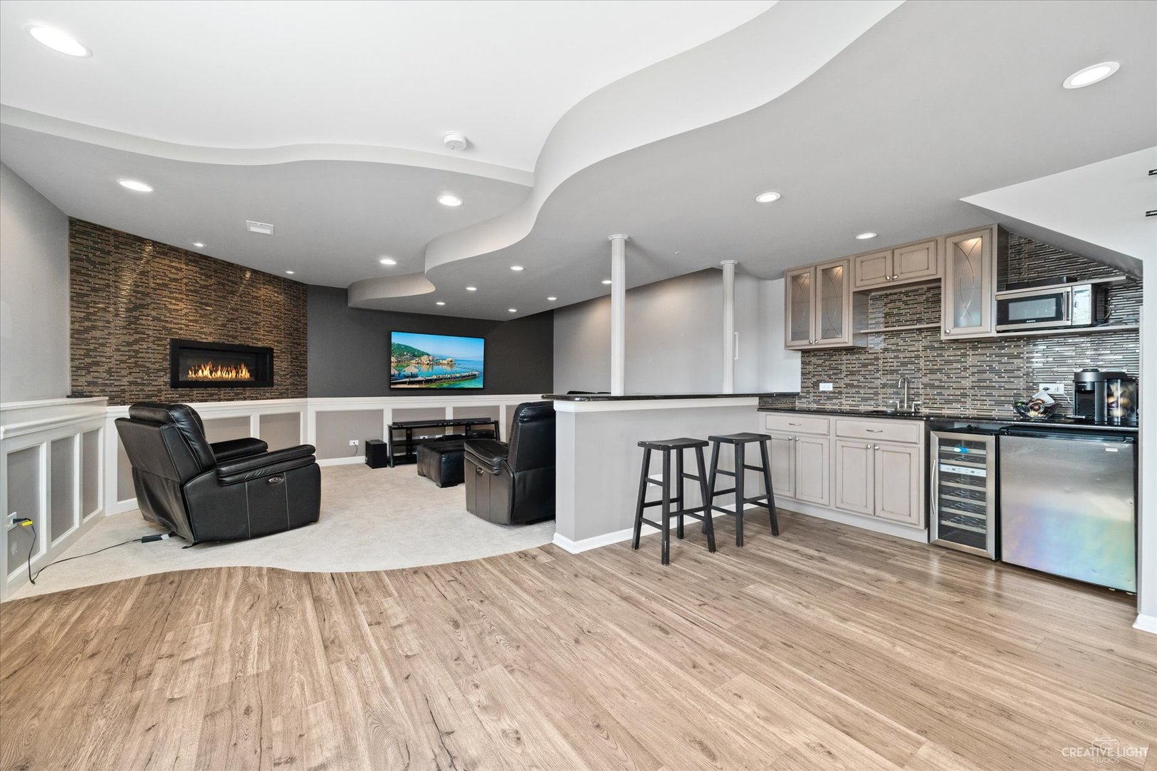 2933 Kelly Drive Elgin, IL 60124 - Photo 40 of 52 a kitchen with stainless steel appliances kitchen island granite countertop a refrigerator a stove a sink dishwasher and a dining table with wooden floor