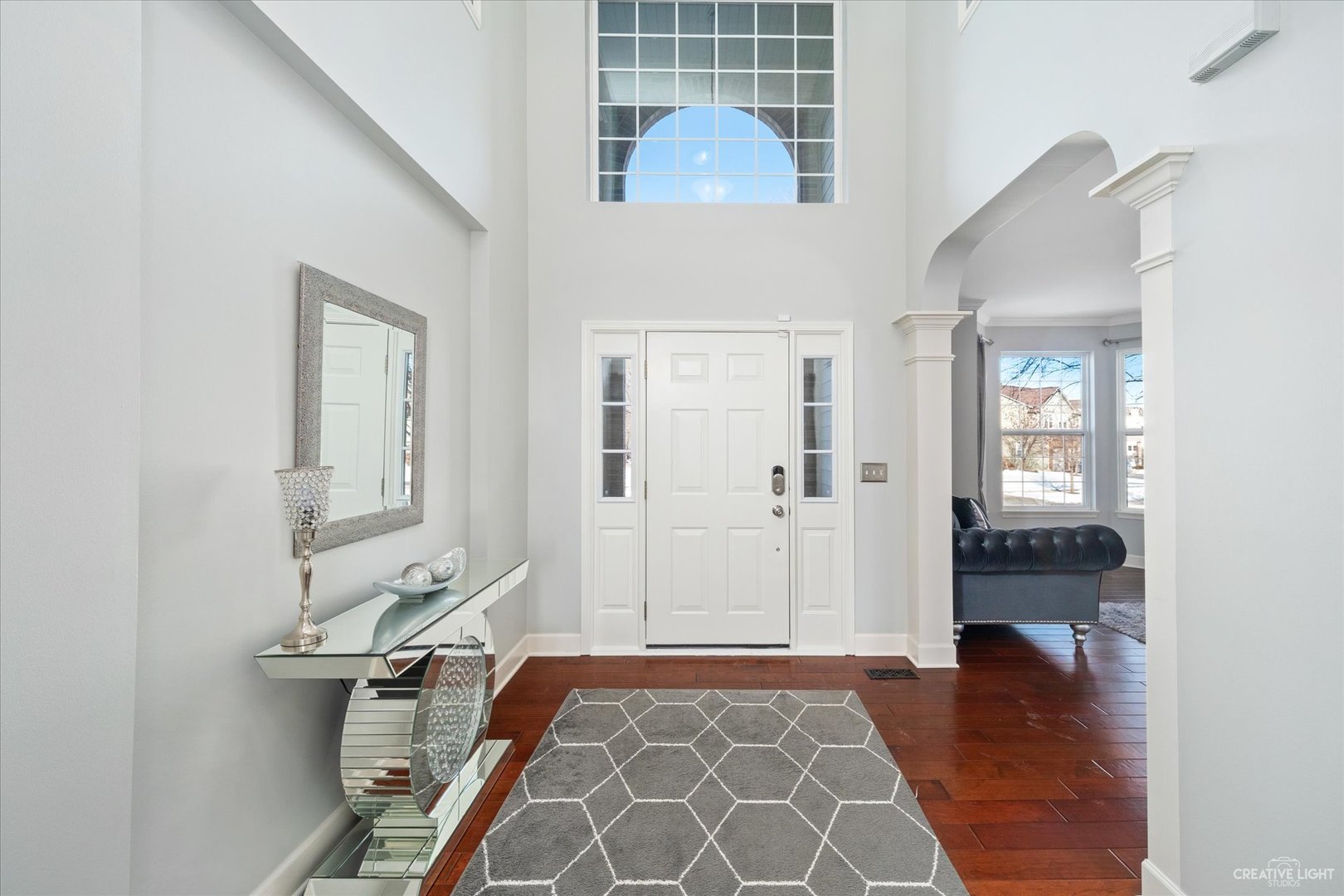 2933 Kelly Drive Elgin, IL 60124 - Photo 4 of 52 a view of a hallway with wooden floor and a bathroom