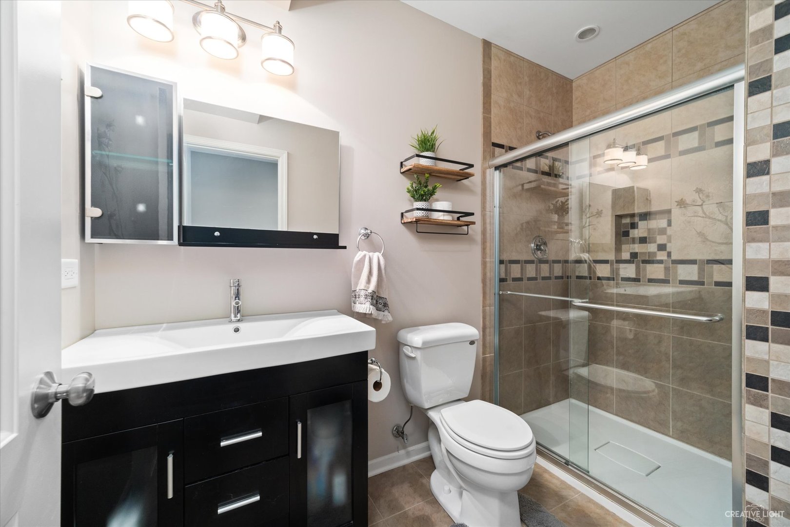 2933 Kelly Drive Elgin, IL 60124 - Photo 44 of 52 a bathroom with a sink toilet and shower