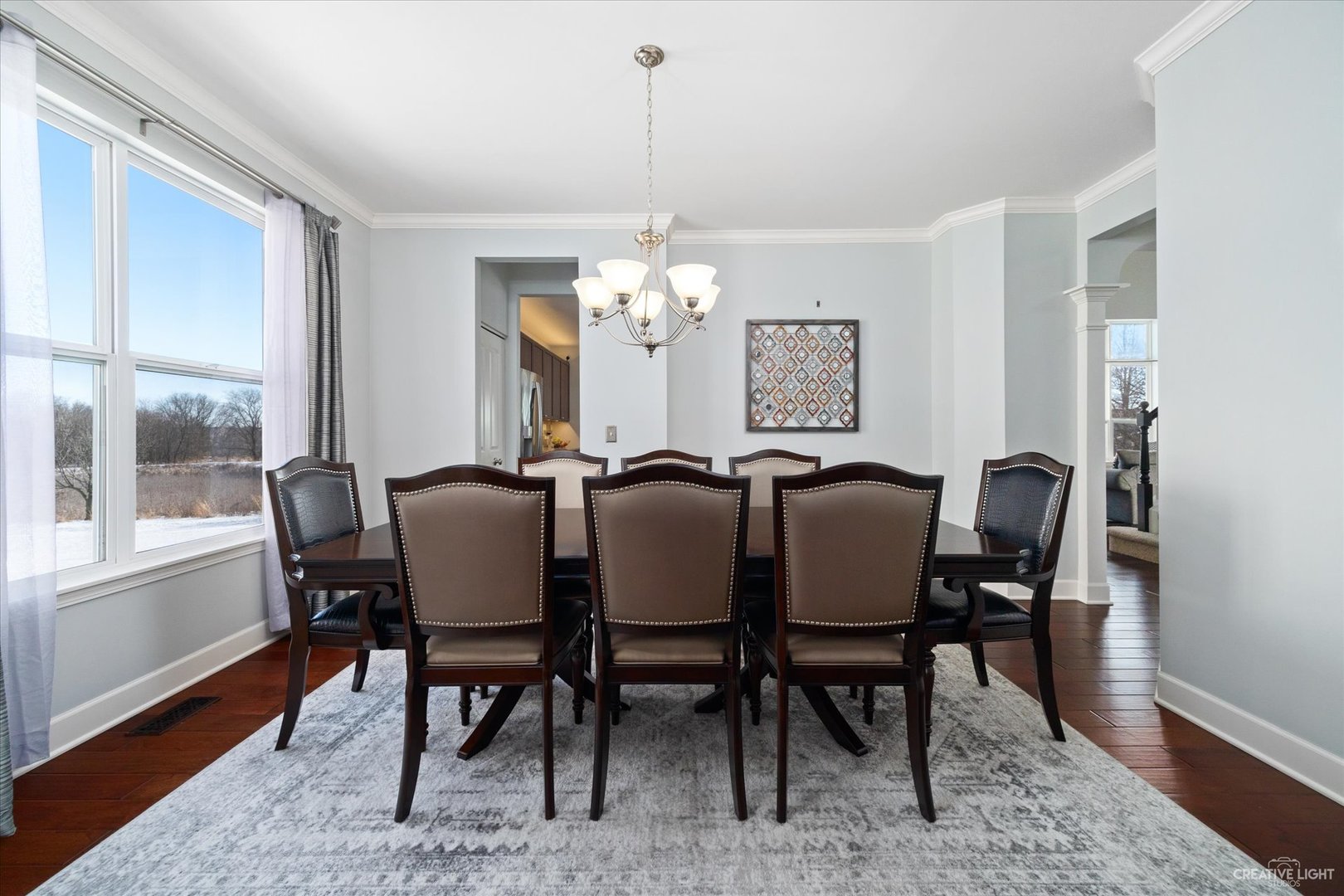2933 Kelly Drive Elgin, IL 60124 - Photo 8 of 52 a view of a dining room with furniture and wooden floor