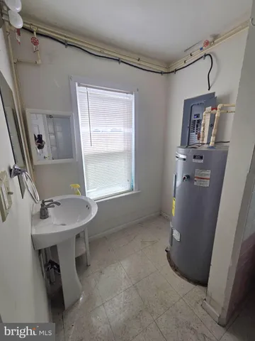 a kitchen with sink cabinets and window