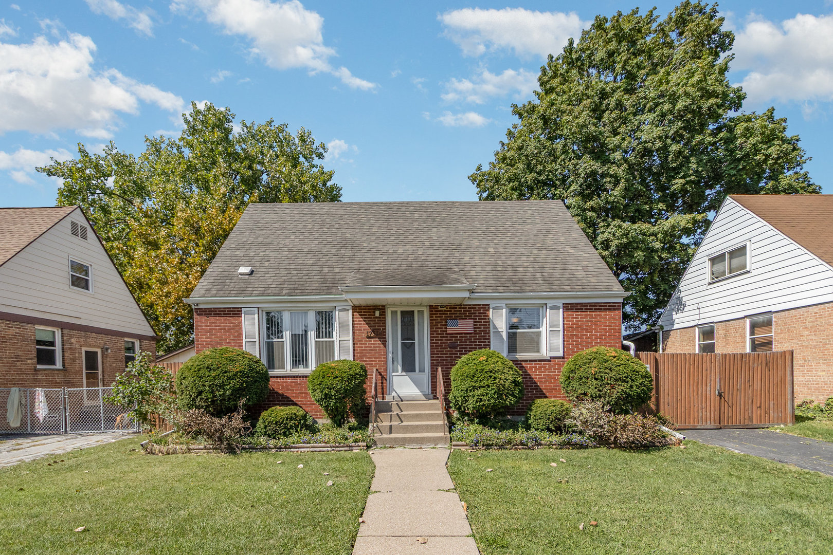 front view of a house with a yard