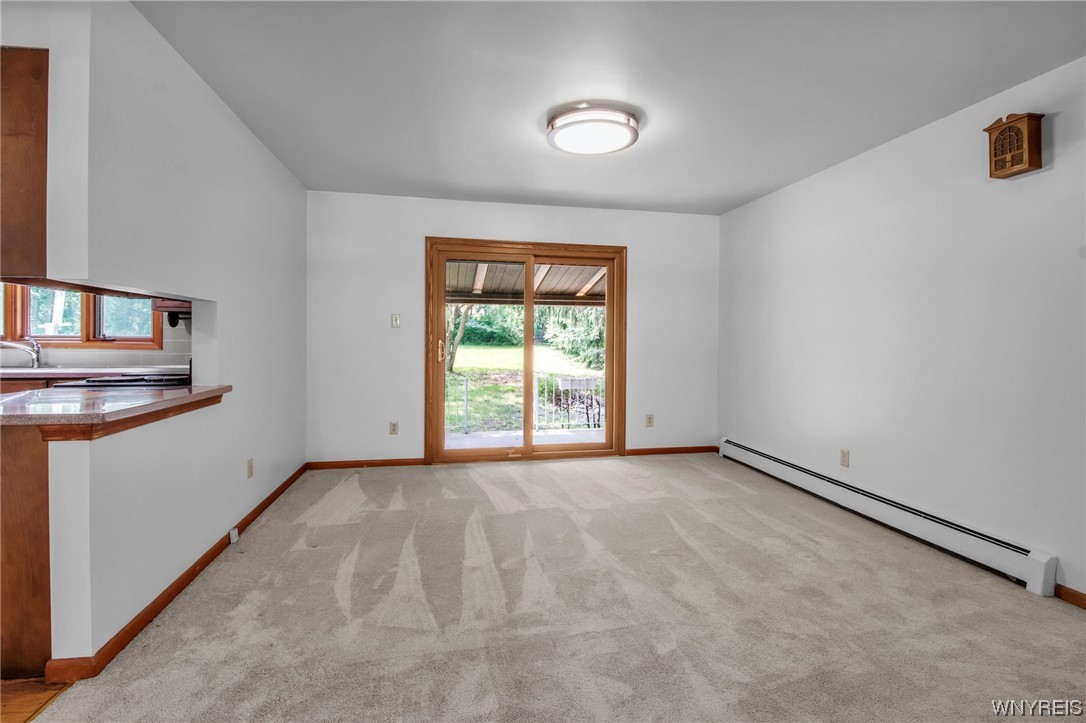 1022 Ridge Road Lewiston, NY 14092 - Photo 25 of 48 Slider door off dining room leads to the covered p