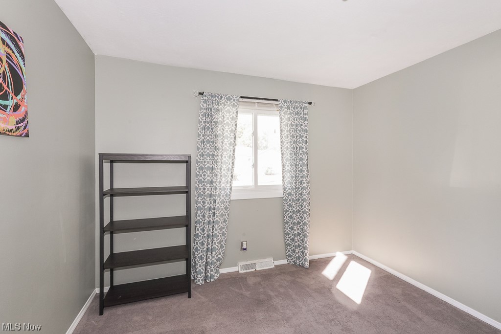 1127 Garden Road Willoughby, OH 44094 - Photo 19 of 33 Spare room featuring dark carpet