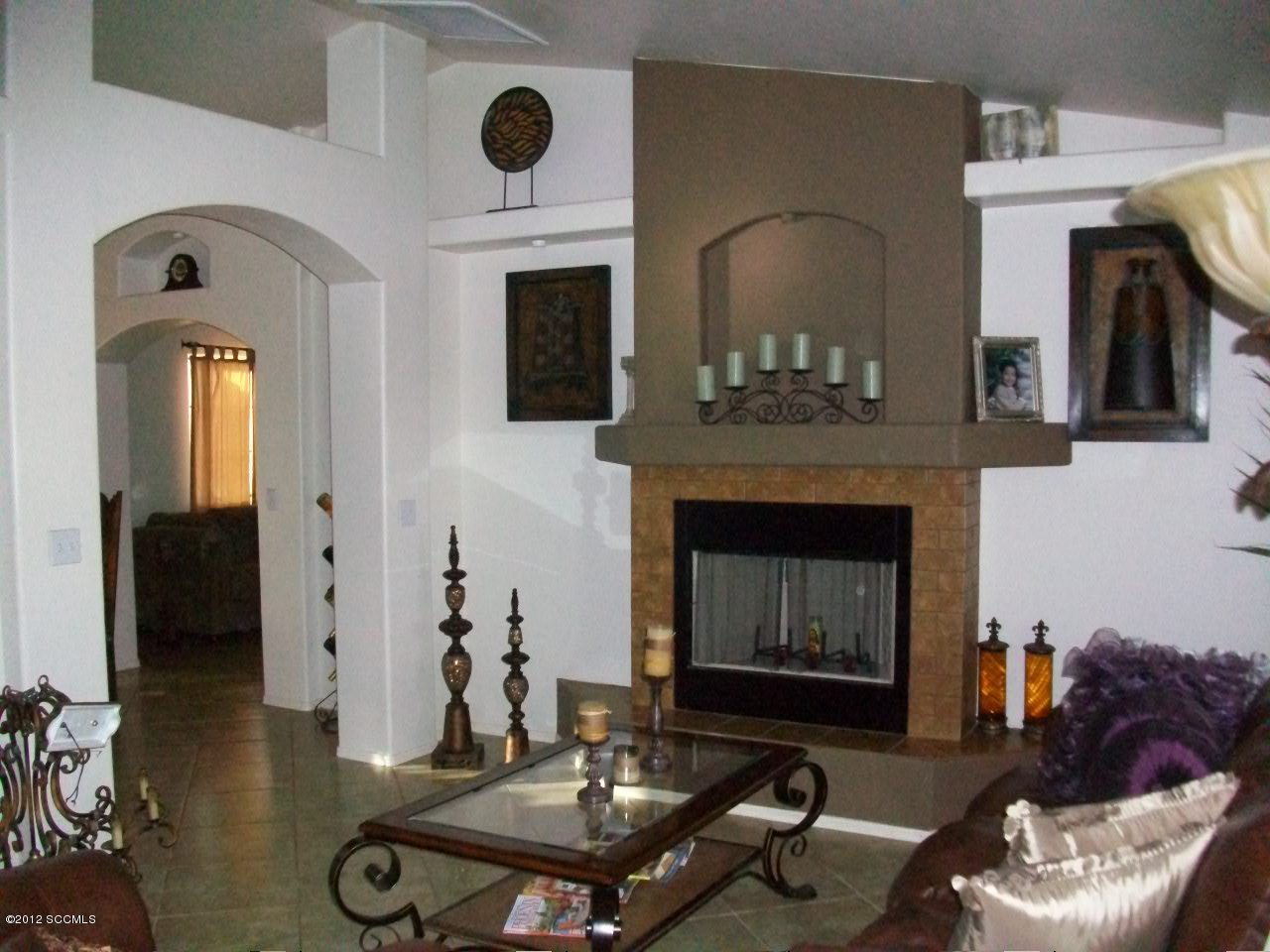 939 Paseo Queretaro Rio Rico, AZ 85648 - Photo 2 of 9 a living room with furniture and a fireplace