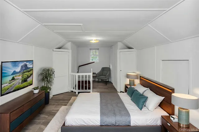 a bedroom with bed and a window