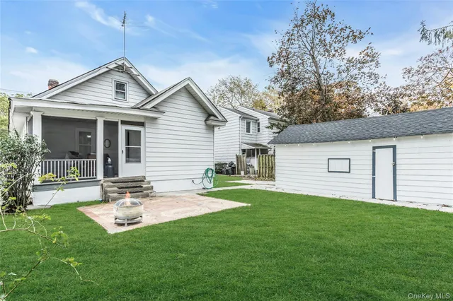 a living room with furniture and potted plant