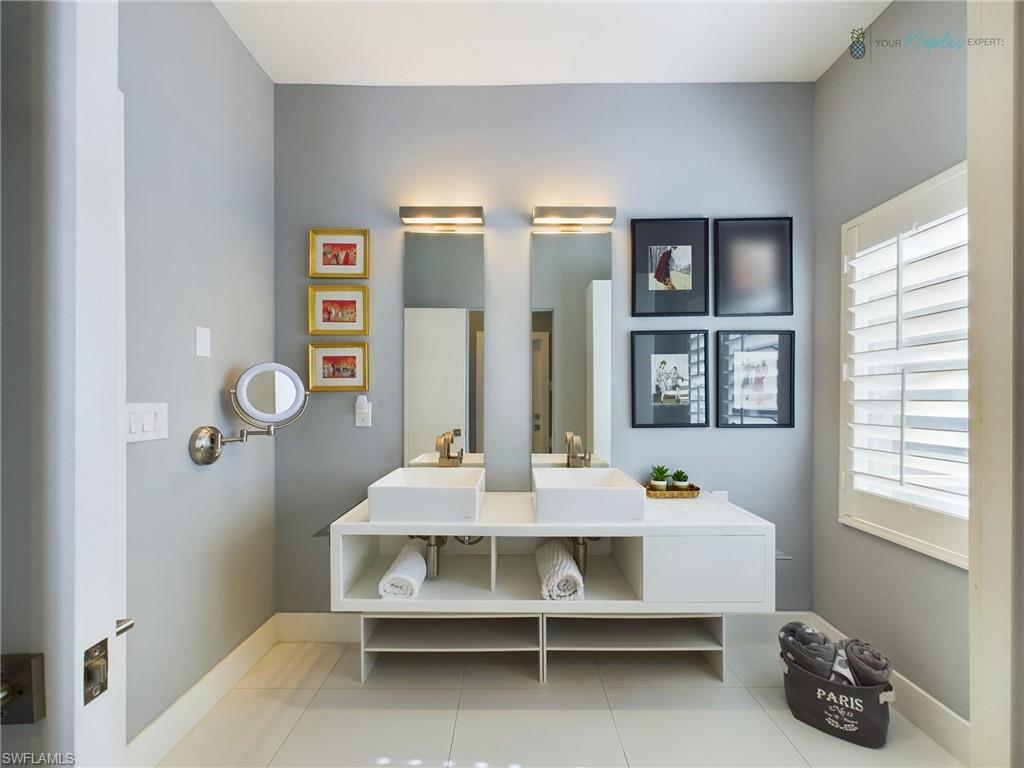 1952 Timarron Way Naples, FL 34109 - Photo 28 of 46 a view of a room with shelves