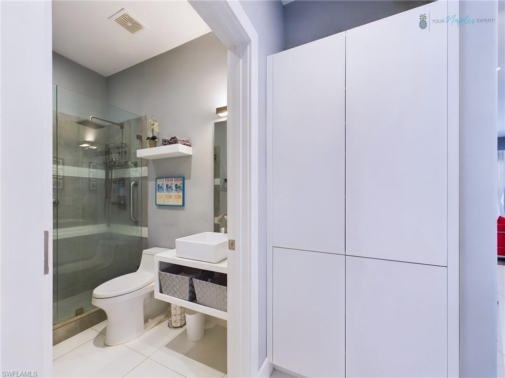 1952 Timarron Way Naples, FL 34109 - Photo 31 of 46 a bathroom with a toilet a sink and shower