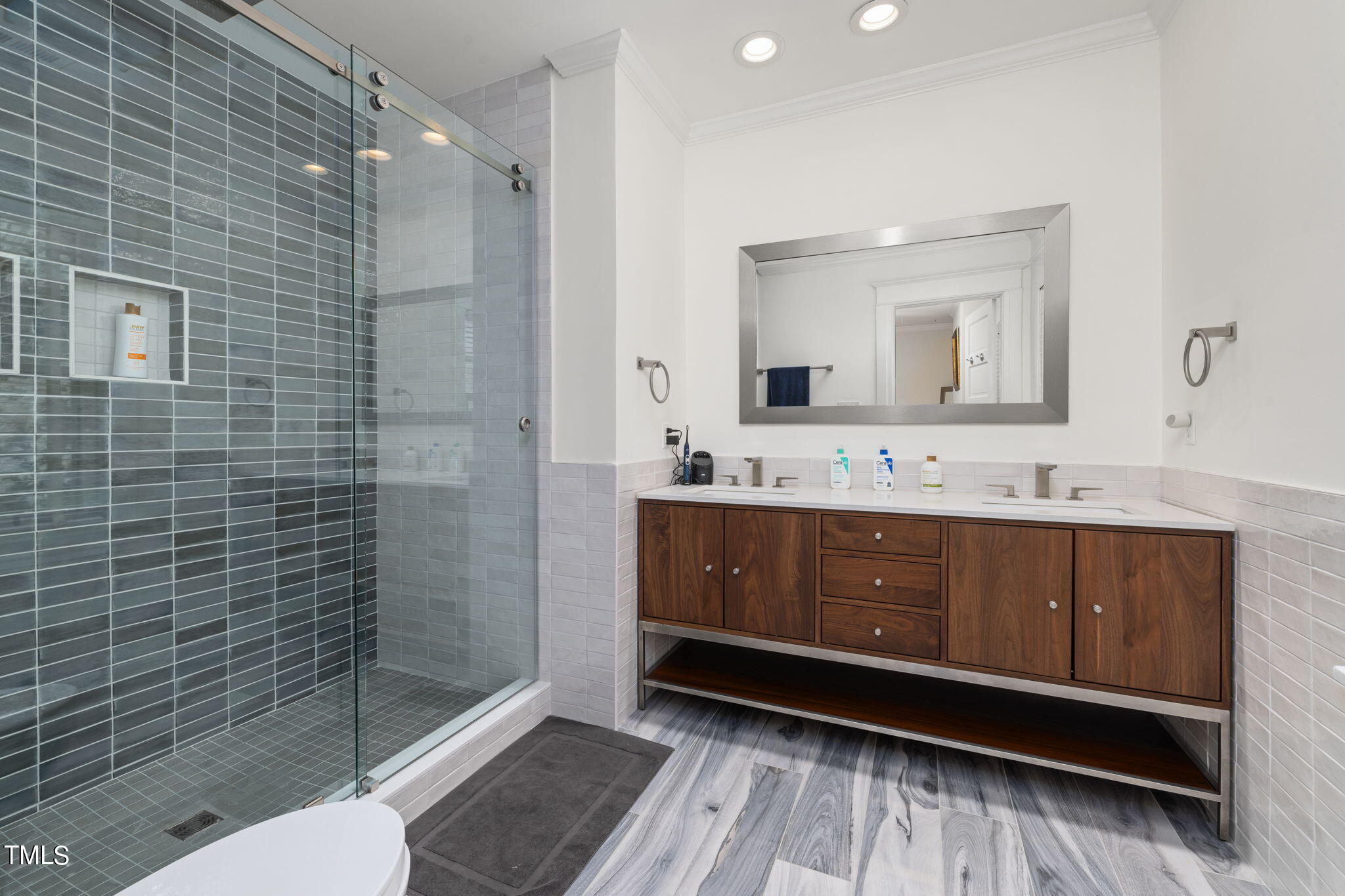 1803 White Oak Road Raleigh, NC 27608 - Photo 17 of 33 a bathroom with a sink a toilet and shower