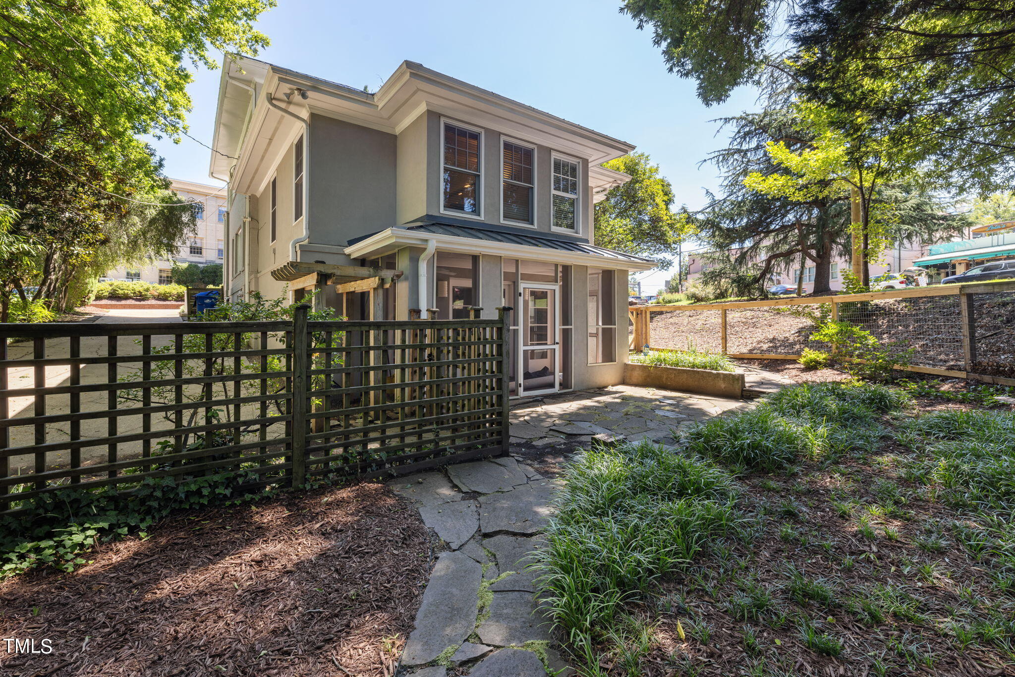 1803 White Oak Road Raleigh, NC 27608 - Photo 26 of 33 a front view of a house with a garden