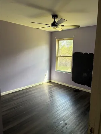 a kitchen with stainless steel appliances a stove a refrigerator and a microwave