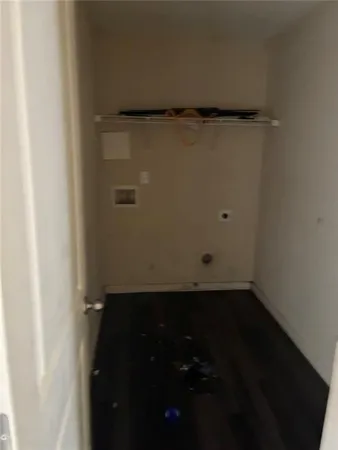 a room with a window and wooden floor