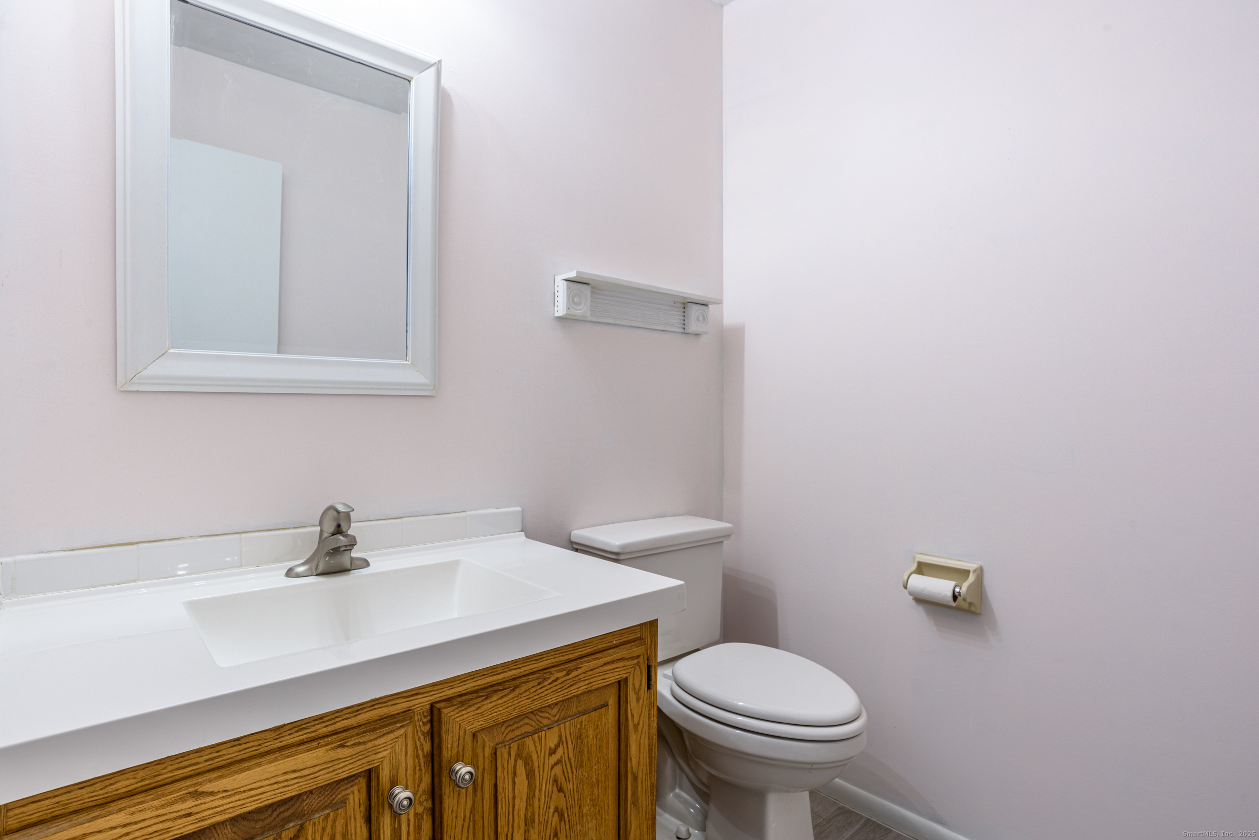 84 Stillmeadow Circle, Unit 84 Monroe, CT 06468 - Photo 11 of 20 a bathroom with a sink a toilet and mirror