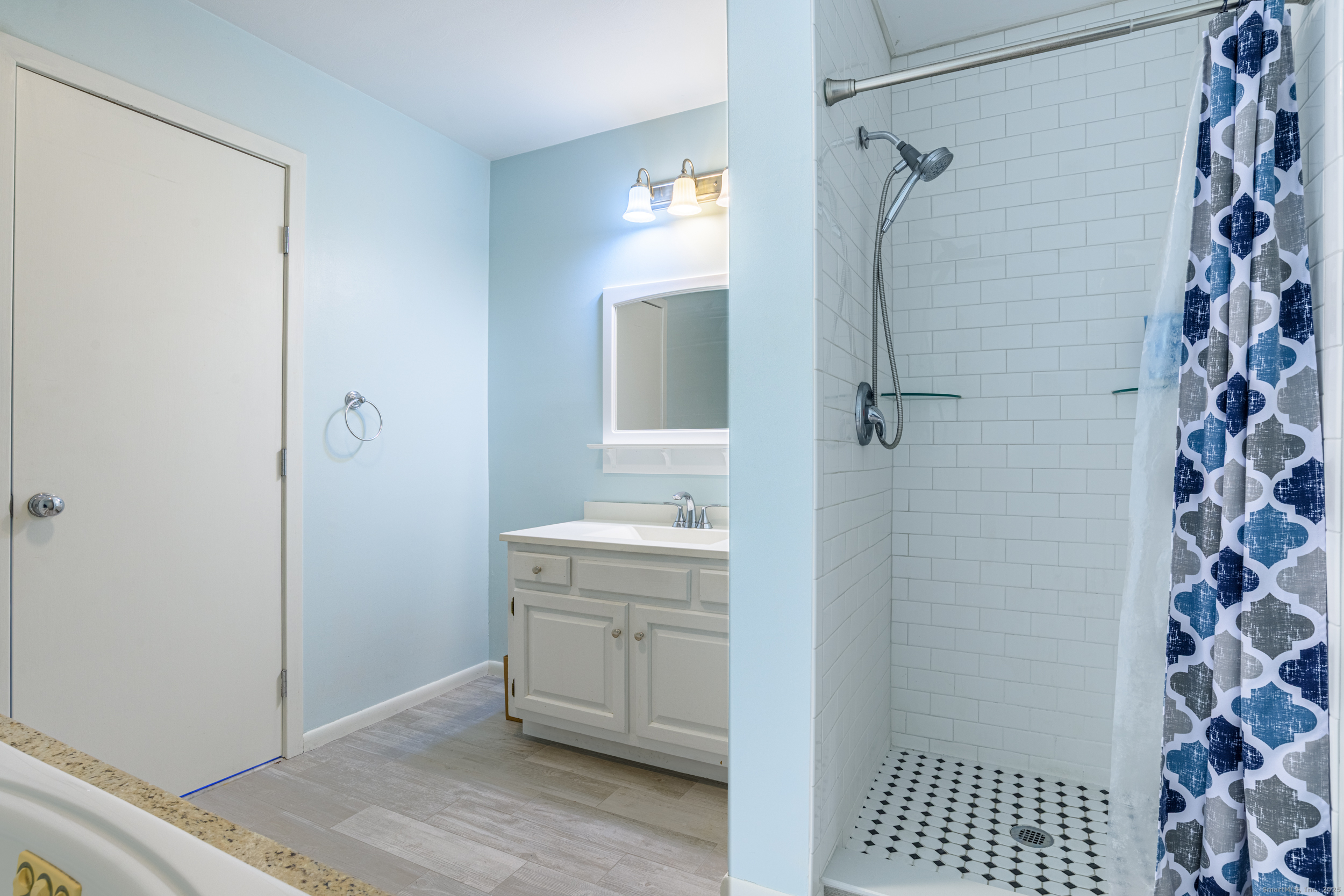 84 Stillmeadow Circle, Unit 84 Monroe, CT 06468 - Photo 13 of 20 a bathroom with a sink a toilet a shower and a mirror