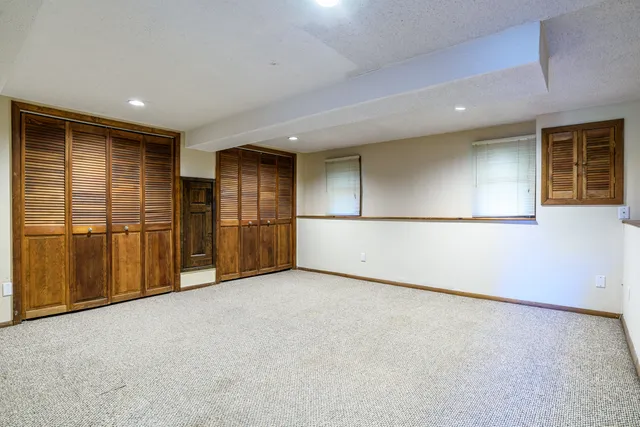 an empty room with closet area