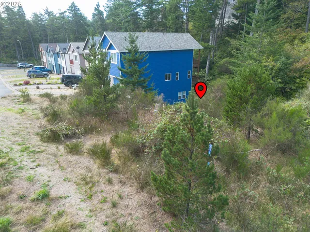 a aerial view of residential house with an outdoor space and seating