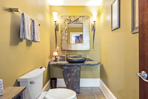 a view of a dining room with furniture wooden floor and chandelier