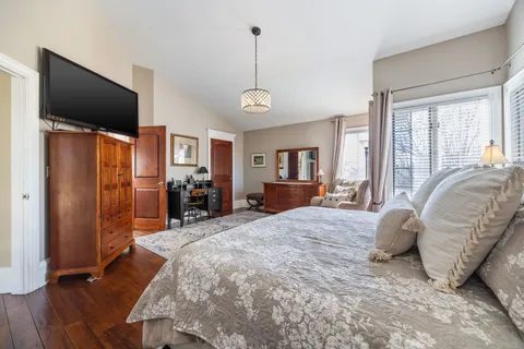 a bedroom with a bed and a lamp