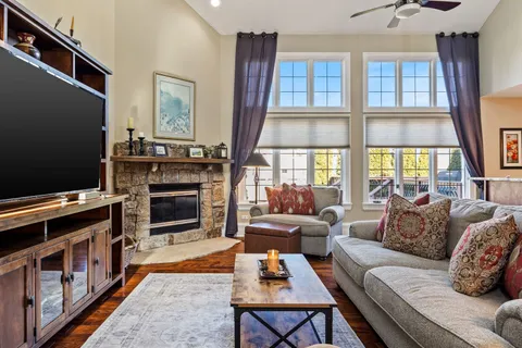 a kitchen with kitchen island a stove and a sink