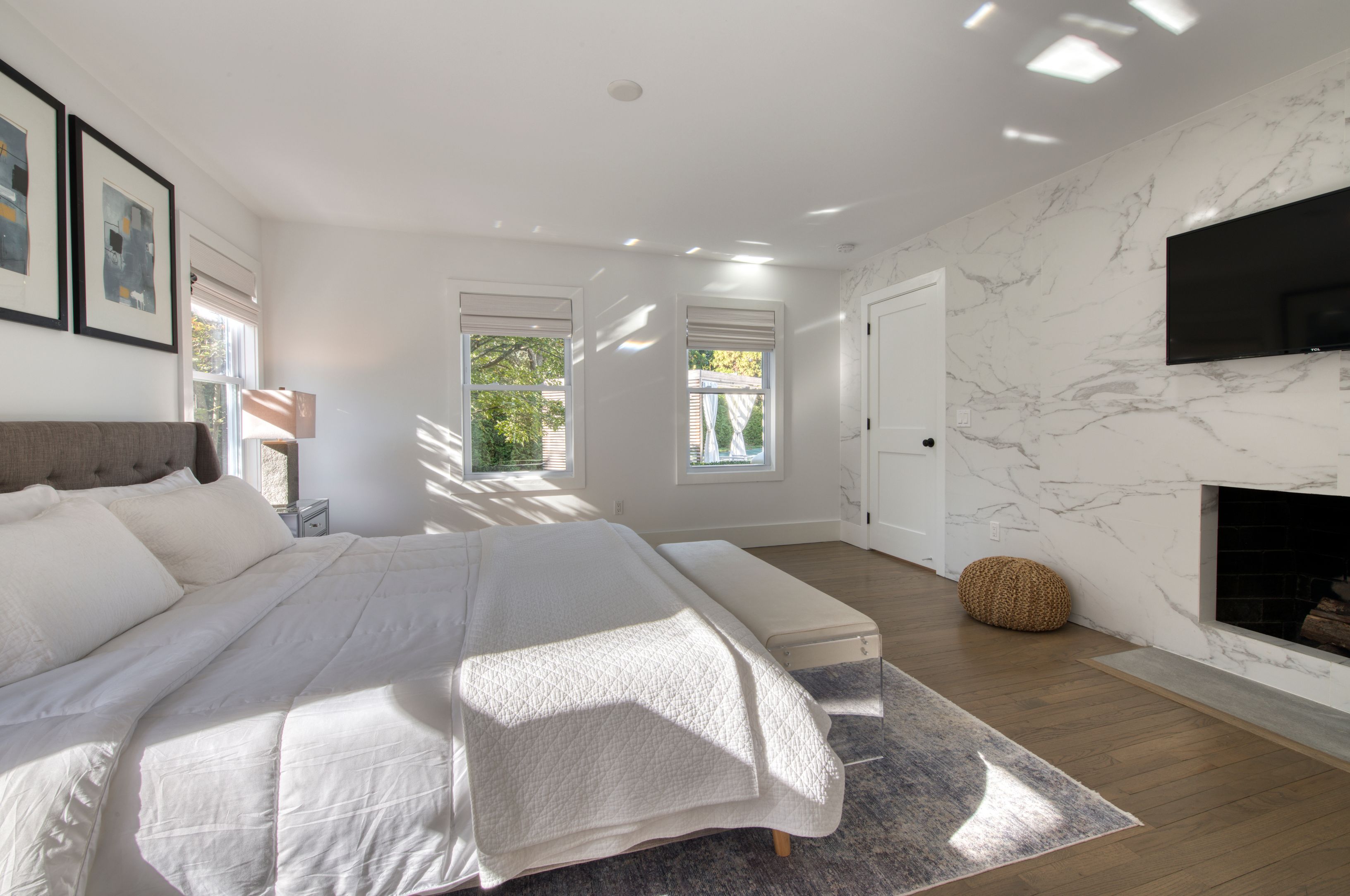 225 Oak Street Bridgehampton, NY 11932 - Photo 12 of 26 a bedroom with a bed and a flat screen tv