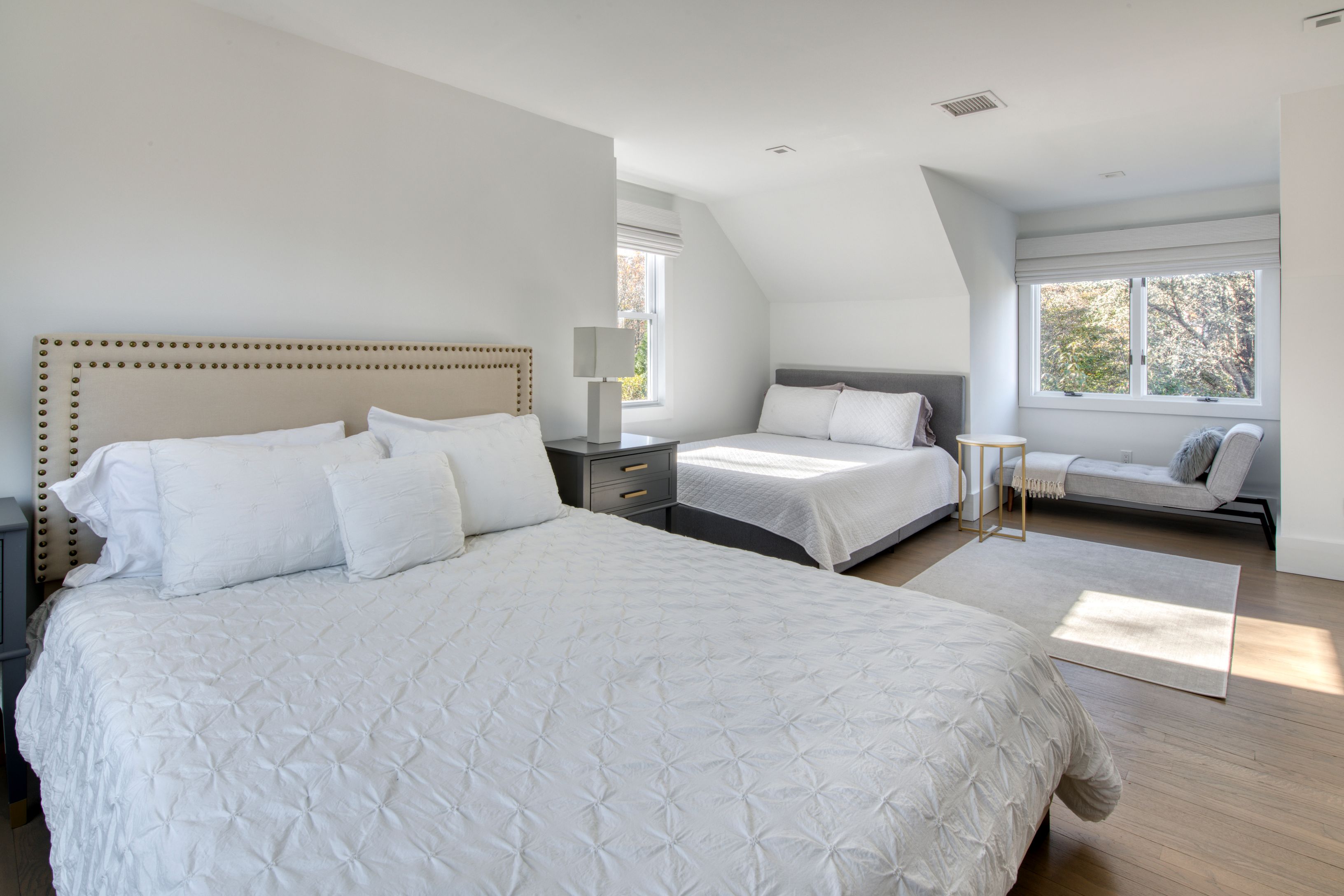 225 Oak Street Bridgehampton, NY 11932 - Photo 15 of 26 a bed room with two bed and a couch